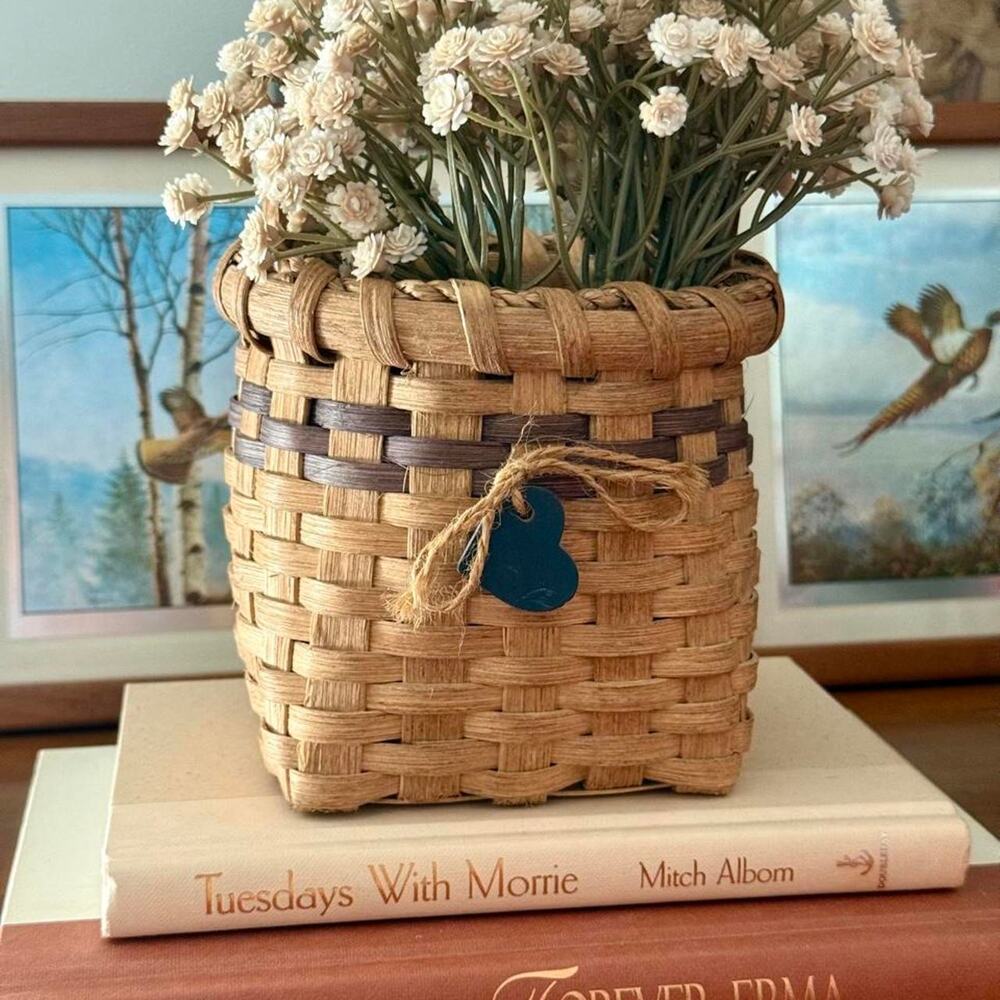 Vintage handwoven wicker basket accent with heart charm and dual handles